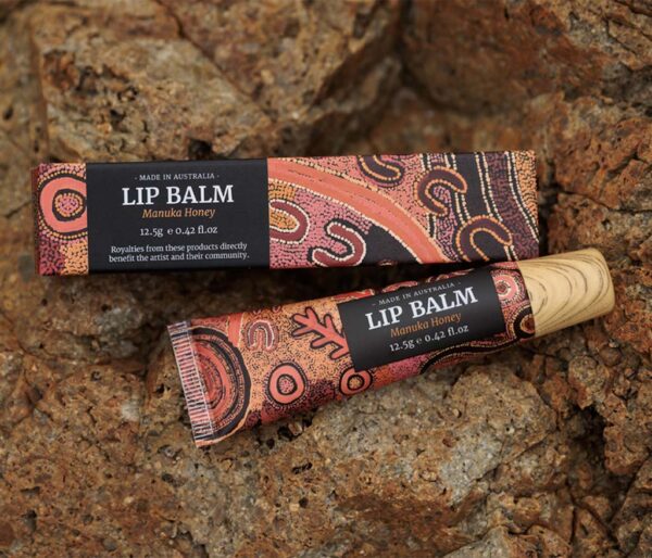 Manuka Honey Lip Balm tube featuring Aboriginal artwork by Theo Nangala Hudson.
