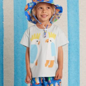 Halcyon Nights Kids Boardshorts in Flamin' Galahs print—lightweight swim shorts with pink galah design, side pockets, elastic waist, and drawcord