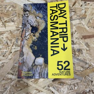 Cover of Day Trip Tasmania: 52 Nature Adventures featuring a collage of Tasmania's diverse landscapes, including mountains, forests, and coastlines.
