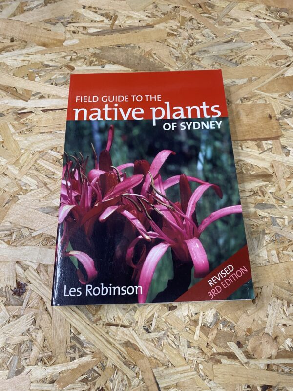 Cover of Field Guide to the Native Plants of Sydney by Les Robinson, featuring detailed illustrations of various native plant species set against a natural backdrop.