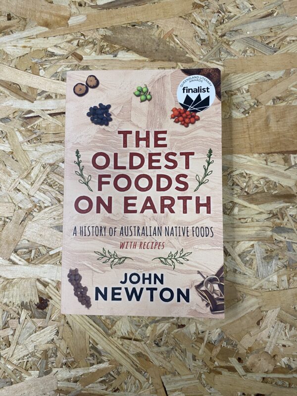 Cover of The Oldest Foods on Earth by John Newton, featuring images of native Australian ingredients such as bush tomatoes, finger limes, and wattleseed, set against a rustic background.