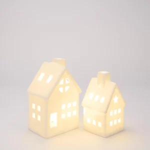 Light-Up Porcelain House Collection – white porcelain houses with chimney and warm internal light, available in four sizes